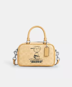 Coach • Coach X Peanuts Satchel Crossbody Bag In Signature Canvas With Charlie Brown